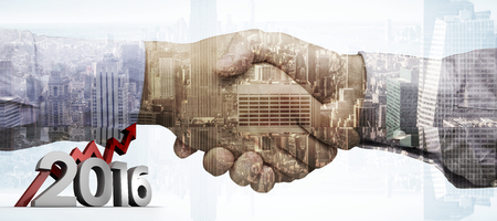 2016 graphic against composite image of hand shakeの写真素材