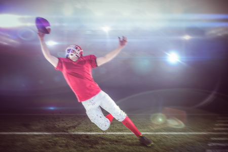 American football player scoring a touchdown against american football arena
