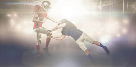 American football players against american football arenaの写真素材