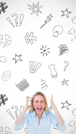 Furious blonde standing and screaming against swearing doodlesの写真素材