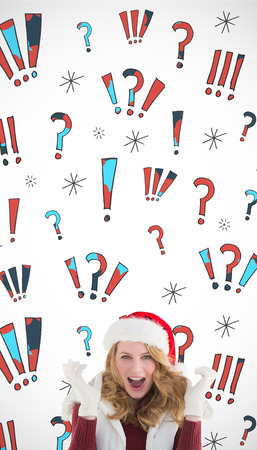 Blonde woman in santa hat screaming at camera against swearing doodlesの写真素材