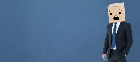 Anonymous businessman against blue backgroundの写真素材