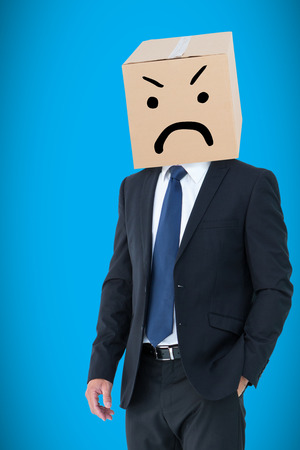 Anonymous businessman against blue background with vignetteの写真素材