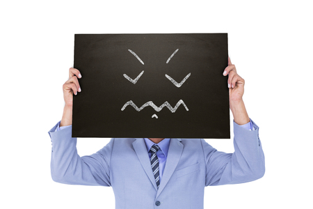 Businessman showing board against white background with vignetteの写真素材