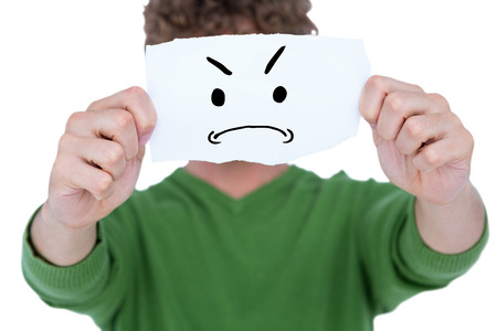 Man holding blank paper in front on face against white background with vignetteの写真素材