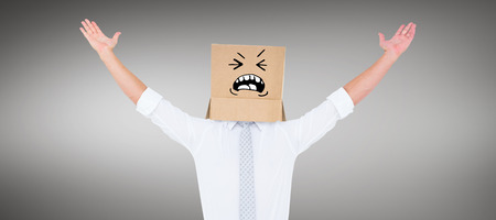 Anonymous cheering businessman against grey vignetteの写真素材