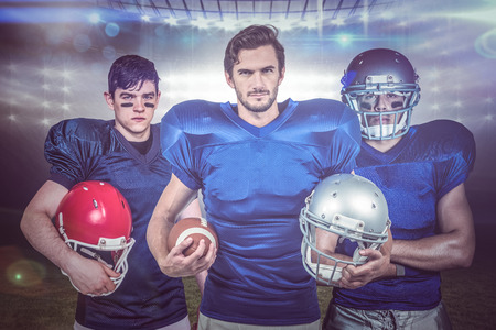 American football team against american football arenaの写真素材