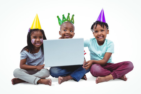 Smiling kids enjoying a party on white screenの写真素材