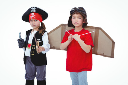 Masked kids pretending to be pirate and pilot on white screenの写真素材