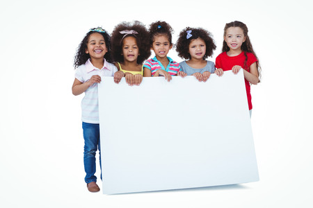 Cute girls holding big paper on white screenの写真素材