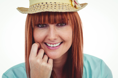 Portrait of a smiling hipster woman wearing hat against white backgroundの写真素材