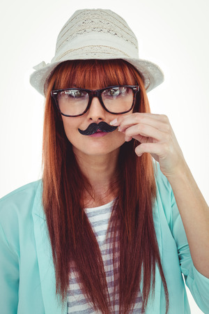 Happy smiling hipster with a mustache against white backgroundの写真素材