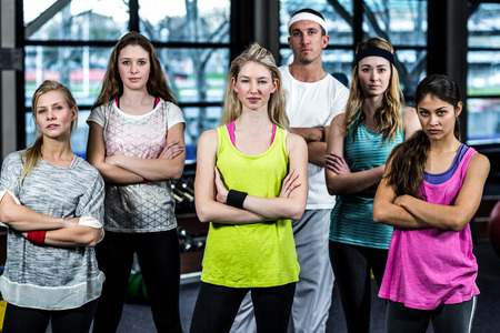 Dancer serious group posing together in the gym