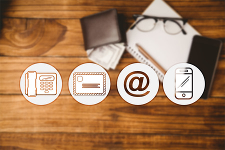 Communication apps against pen and glasses on notepad next to wallet and smartphoneの写真素材