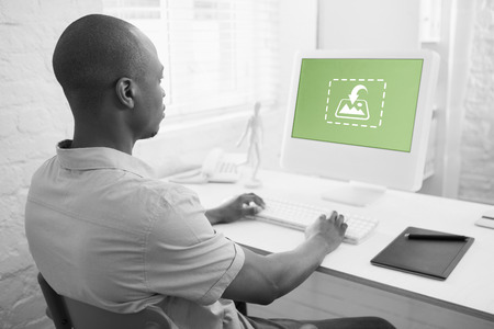 Photography apps against casual businessman looking at computer screen