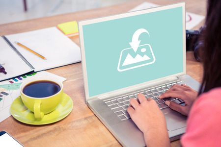 Photography apps against cropped image of businesswoman working on laptop