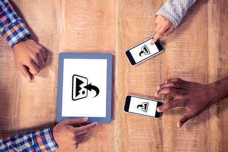 Photography apps against cropped image of hands using mobile phone and tablet pcの写真素材