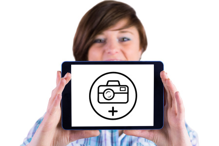 Portrait of woman showing digital tablet against photography apps