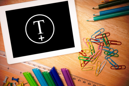 T plus circle against students desk with tablet pcの写真素材