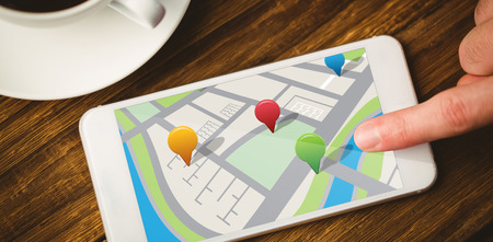 Map app against smartphone on desk