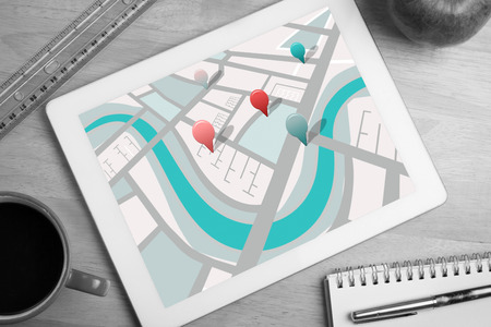Map app against tablet on deskの写真素材