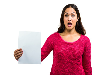 Portrait of worried woman holding document on white backgroundの写真素材
