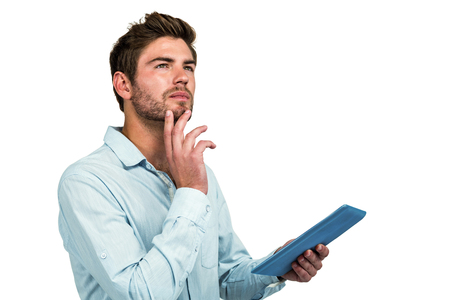 Thoughtful man using tablet on white backgroundの写真素材