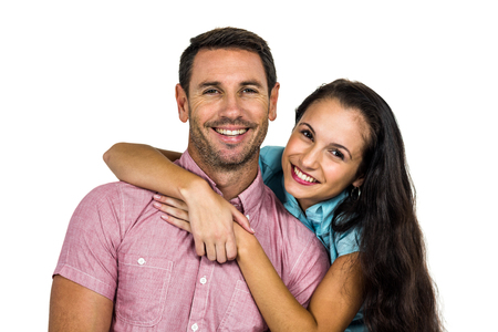 Portrait of happy couple on white backgroundの写真素材