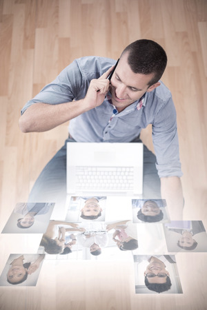 Business people having a meeting  against businessman talking on mobile phoneの写真素材