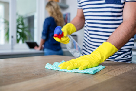 Cute couple cleaning up the kitchenの写真素材