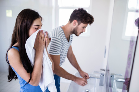 Young couple in bathroom in morningの写真素材