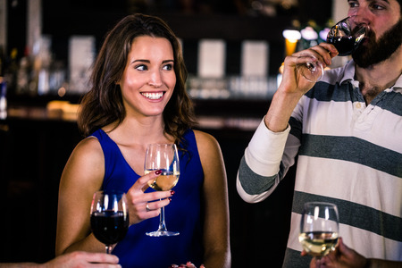 Friends having a glass of wine in a bar