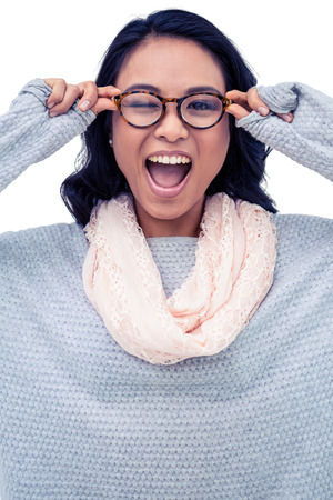 Asian woman holding eyeglasses on white screenの写真素材
