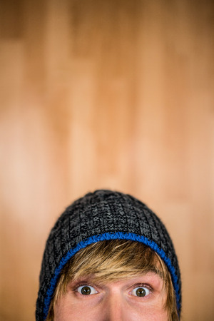 Close up of half face of hipster man staring at cameraの写真素材