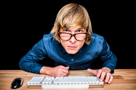 Hipster businessman looking closely the camera on black screen