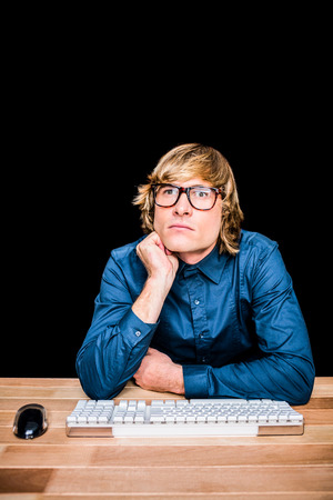 Thoughtful hipster businessman on black screenの写真素材