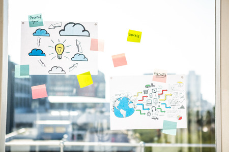 Adhesive notes on window in officeの写真素材