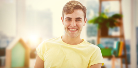 Smiling casual business man against view of a business desk