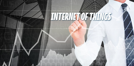 The word solution and businessman pointing with his finger against stocks and sharesの写真素材