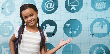 Portrait of a girl showing hand gesture against blue matrixの写真素材
