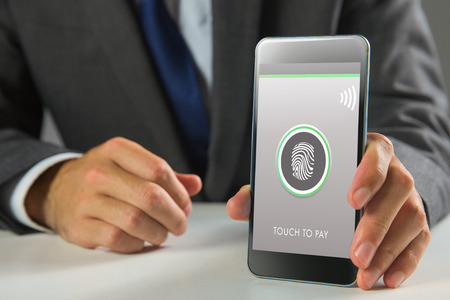 Businessman using smartphone against web