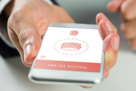 Man using smartphone against web
