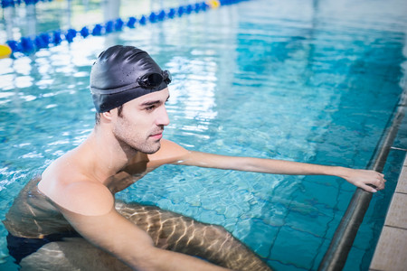 Concentrated man in the pool at the leisure centerの写真素材