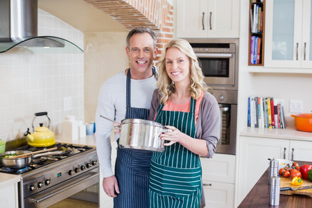 Cute couple cooking in the kitchenの写真素材