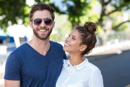 Hip couple posing for the camera in the cityの写真素材