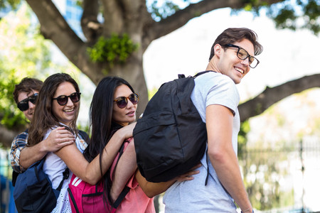 Hip friends walking and talking in the streetsの写真素材