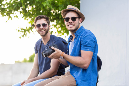 Hip friends taking pictures in the streets