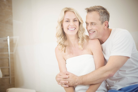 Cute couple hugging in the bathroomの写真素材