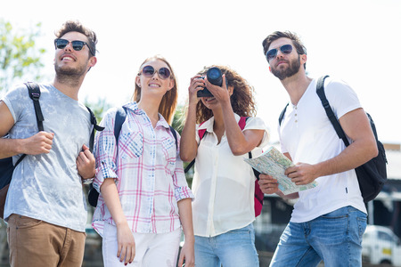 Hip friends visiting a city and taking picture