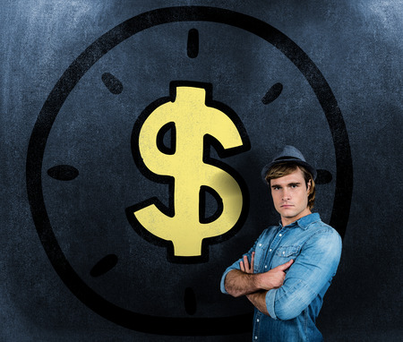 Serious hipster crossing his arms against black backgroundの写真素材